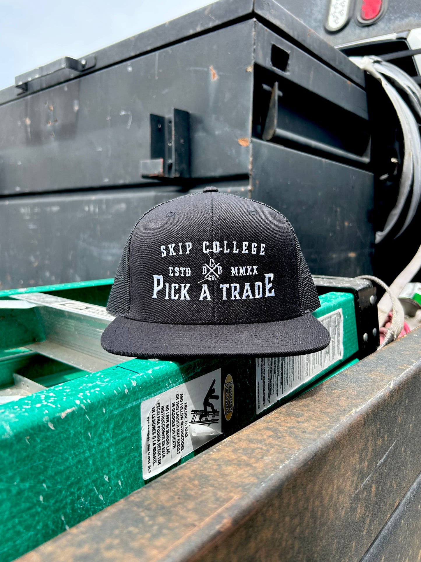 Skip College Flat Bill Trucker Hat